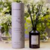 Stoneglow's Cotton Flower Reed Diffuser from The Walled Garden Collection, featuring a luxurious glass bottle with natural rattan reeds, infused with a tranquil floral fragrance of rose, jasmine, and lily.