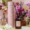 Stoneglow's Ginger Lily Reed Diffuser from The Walled Garden Collection, featuring a luxurious glass bottle and natural rattan reeds, with a fragrance blend of lily, magnolia, and ginger.