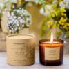 Stoneglow's Golden Mimosa Tumbler Candle from The Walled Garden Collection, featuring a natural wax blend and a radiant floral fragrance of mimosa, violet, and rose.