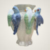 Decorative vase with perched parrots